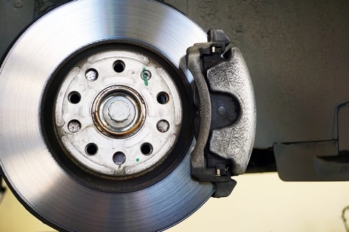 Most Common Brake Repair Services – and When to Come into the Shop with Mast Service Center in Gretna In closeup image of new brake and pads