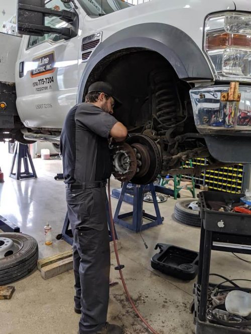 A Mast Service Center technician working on a fleet vehicle. We provide fleet service for your business.